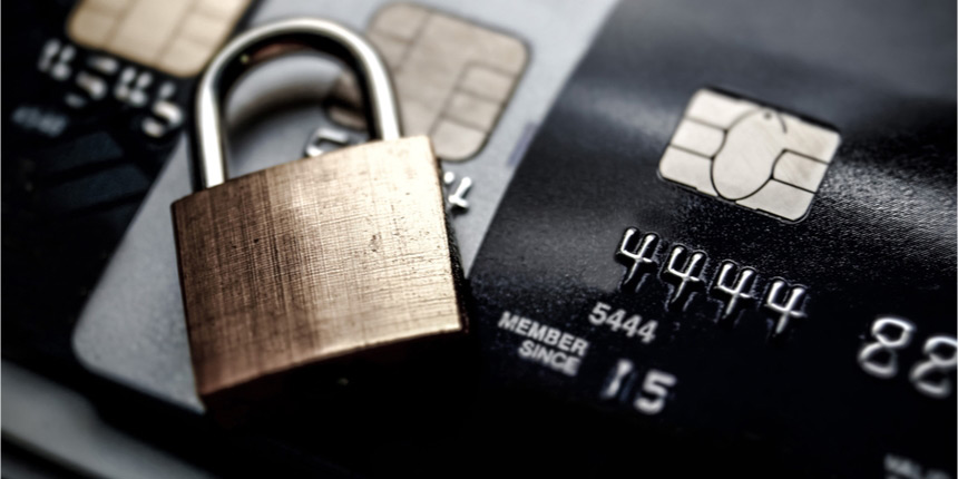 Close up of bank card with lock resting on it