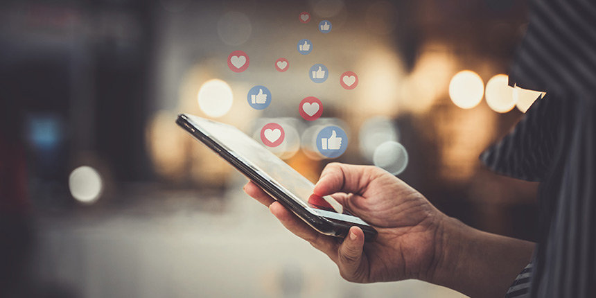Social phone with lots of likes symbols
